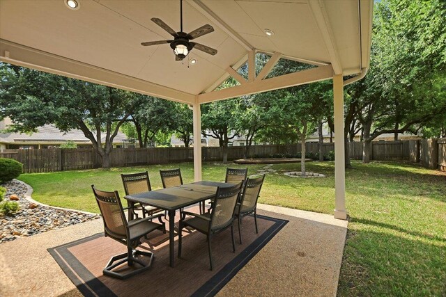 view of patio with a fenced backyard, outdoor dining space, and ceiling fan
