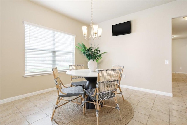 1504 Maier Dr, Pflugerville, TX 78660 - dining space featuring light tile patterned floors, a chandelier, and baseboards