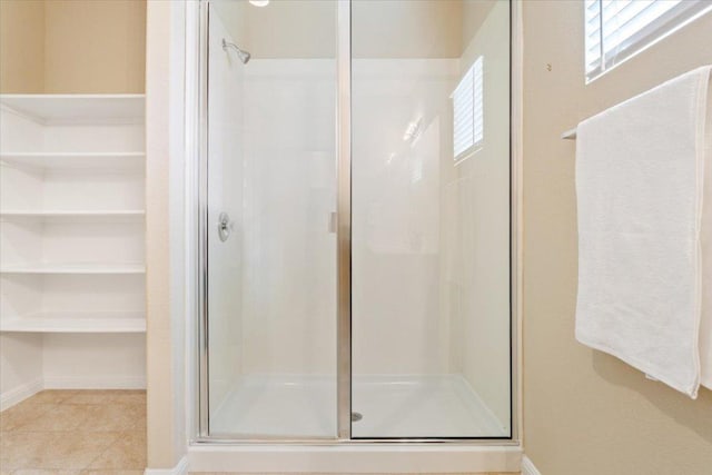 1504 Maier Dr, Pflugerville, TX 78660 - bathroom with a stall shower, tile patterned flooring, and baseboards