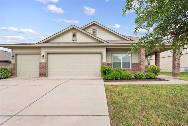 1504 Maier Dr, Pflugerville, TX 78660 - ranch-style house featuring brick siding, a garage, concrete driveway, and a front yard