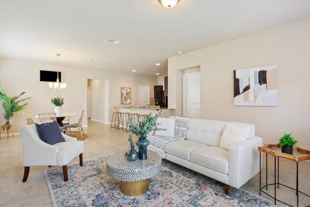 1504 Maier Dr, Pflugerville, TX 78660 - living room with baseboards, a chandelier, and recessed lighting