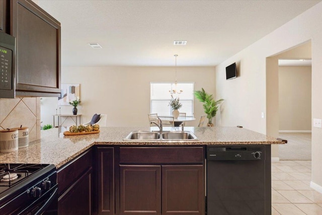 1504 Maier Dr, Pflugerville, TX 78660 - kitchen featuring black appliances, a sink, a peninsula, decorative backsplash, and light stone countertops