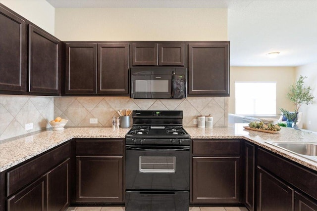 1504 Maier Dr, Pflugerville, TX 78660 - kitchen featuring black appliances, dark brown cabinetry, and backsplash
