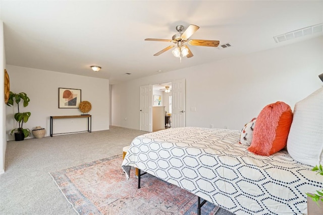 bedroom featuring visible vents, carpet floors, and ceiling fan