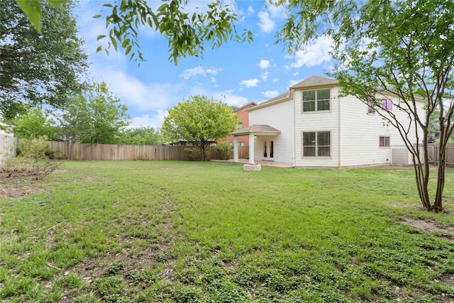 view of yard with a patio and a fenced backyard
