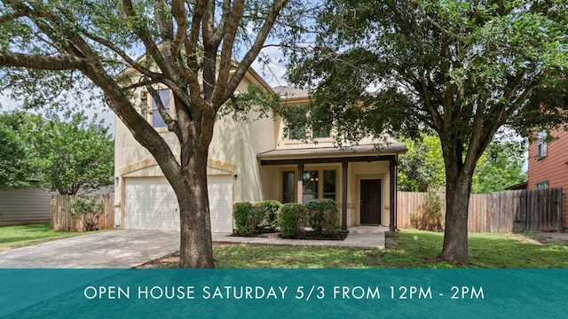 view of front facade featuring fence, an attached garage, concrete driveway, and stucco siding