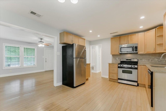 kitchen featuring visible vents, appliances with stainless steel finishes, open shelves, a sink, and light brown cabinets