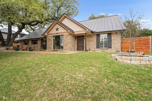 2100 Four Oaks Ln, Austin, TX 78704 - ranch-style house featuring brick siding, metal roof, and a standing seam roof