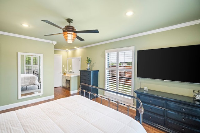 2100 Four Oaks Ln, Austin, TX 78704 - bedroom featuring wood finished floors, multiple windows, recessed lighting, ornamental molding, and baseboards