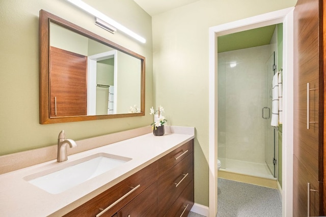 2100 Four Oaks Ln, Austin, TX 78704 - bathroom with vanity, a stall shower, and toilet