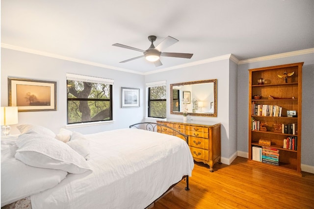 2100 Four Oaks Ln, Austin, TX 78704 - bedroom with light wood-style flooring, crown molding, baseboards, and ceiling fan