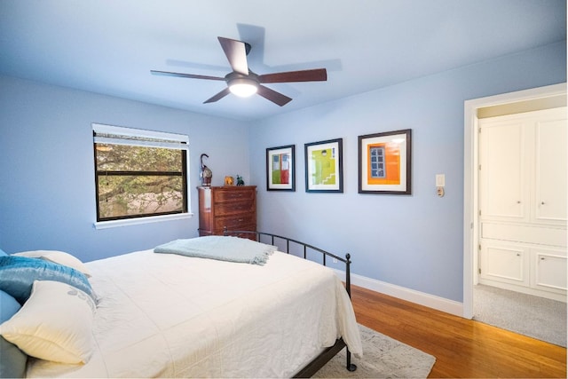 2100 Four Oaks Ln, Austin, TX 78704 - bedroom featuring wood finished floors, baseboards, and ceiling fan