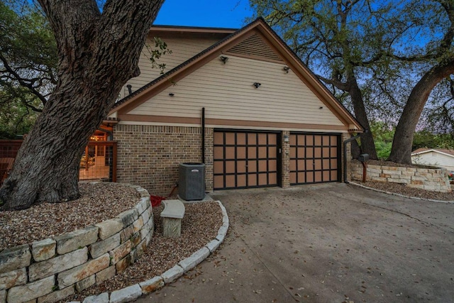 2100 Four Oaks Ln, Austin, TX 78704 - garage with concrete driveway and central AC