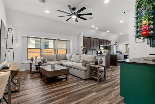 227 Biscayne Bay Bnd, Kyle, TX 78640 - living area with vaulted ceiling, a ceiling fan, dark wood-style floors, and recessed lighting