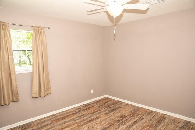 3477 Bradley Ln, Brenham, TX 77833 - spare room with baseboards, a ceiling fan, and wood finished floors