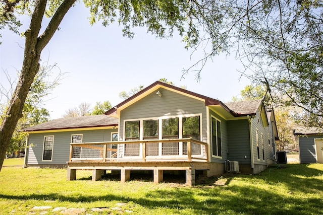 3477 Bradley Ln, Brenham, TX 77833 - rear view of property with a lawn, central AC, and a deck