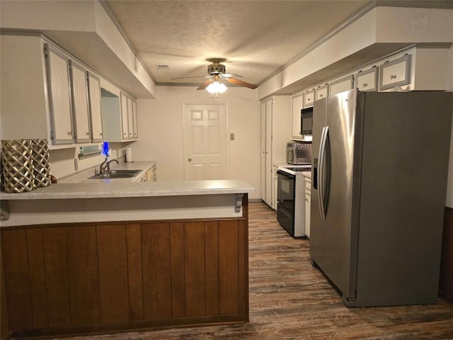 3477 Bradley Ln, Brenham, TX 77833 - kitchen featuring black microwave, a sink, electric range oven, a peninsula, and stainless steel refrigerator with ice dispenser
