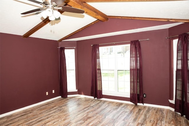 3477 Bradley Ln, Brenham, TX 77833 - unfurnished room featuring baseboards, lofted ceiling with beams, ceiling fan, and wood finished floors