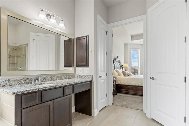 1800 Erie Dr, Leander, TX 78641 - bathroom featuring vanity, a shower stall, connected bathroom, and tile patterned floors