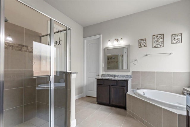 1800 Erie Dr, Leander, TX 78641 - full bath featuring vanity, a shower stall, a bath, and tile patterned floors