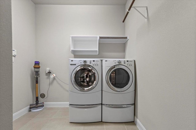 1800 Erie Dr, Leander, TX 78641 - washroom featuring independent washer and dryer and light tile patterned floors