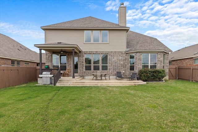 1800 Erie Dr, Leander, TX 78641 - rear view of property with a chimney, a fenced backyard, a patio, and brick siding