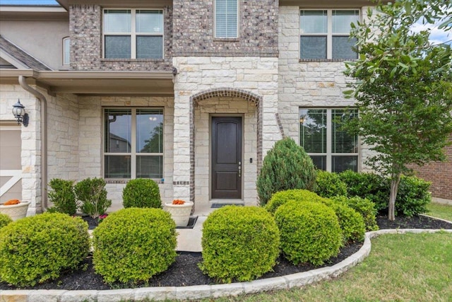 1800 Erie Dr, Leander, TX 78641 - property entrance featuring stone siding and a porch