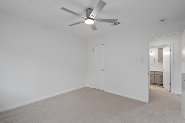 3608 Branigan Ln, Austin, TX 78759 - unfurnished bedroom featuring light colored carpet, baseboards, and a ceiling fan