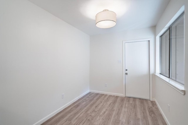 3608 Branigan Ln, Austin, TX 78759 - empty room with light wood-style floors and baseboards