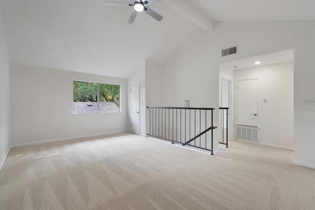 3608 Branigan Ln, Austin, TX 78759 - empty room with beam ceiling, carpet floors, high vaulted ceiling, baseboards, and visible vents