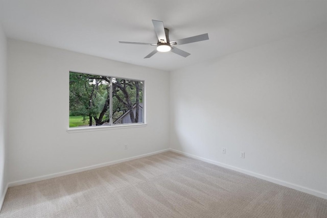 3608 Branigan Ln, Austin, TX 78759 - carpeted spare room with baseboards and ceiling fan