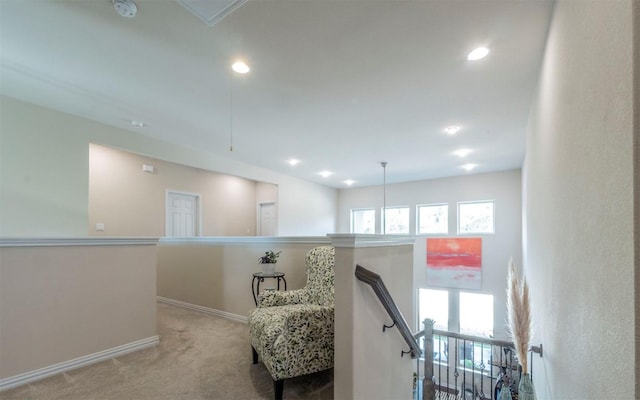 corridor with baseboards, attic access, recessed lighting, carpet flooring, and an upstairs landing