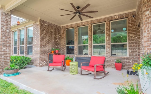 view of patio featuring ceiling fan