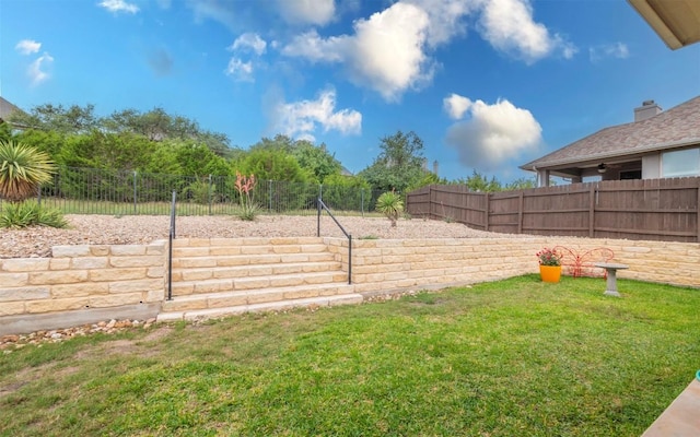view of yard featuring a fenced backyard