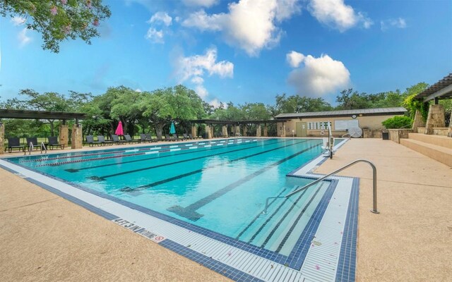 pool featuring a patio area