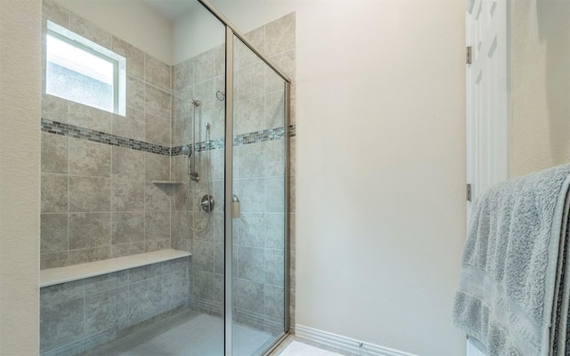 bathroom featuring a shower stall
