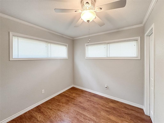 209 Lake Frst, Canyon Lake, TX 78133 - empty room with a ceiling fan, baseboards, ornamental molding, and wood finished floors