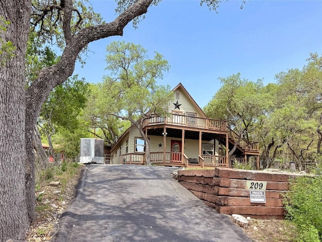 209 Lake Frst, Canyon Lake, TX 78133 - view of front facade featuring a porch and driveway