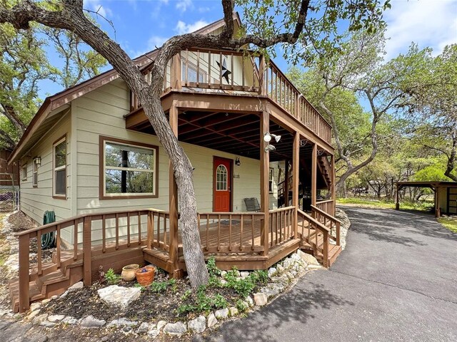 209 Lake Frst, Canyon Lake, TX 78133 - rustic home with driveway and a deck