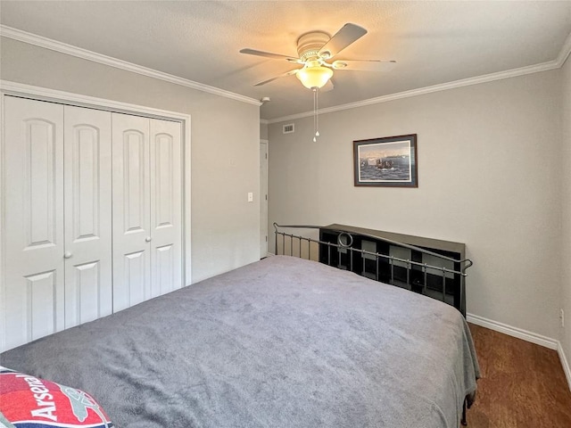 209 Lake Frst, Canyon Lake, TX 78133 - carpeted bedroom with crown molding, baseboards, a closet, and visible vents