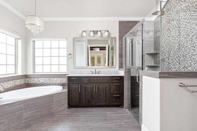 2120 High Lonesome Dr, Leander, TX 78641 - full bathroom with vanity, a bath, crown molding, a stall shower, and tile patterned floors