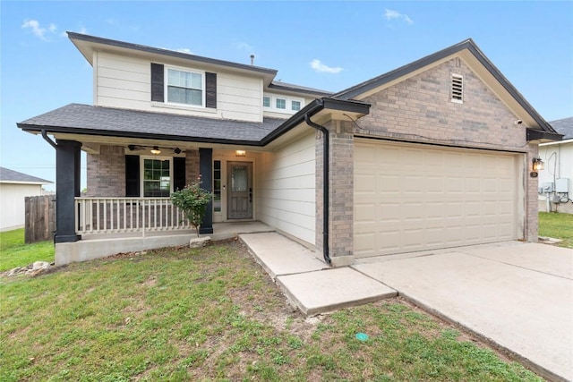 234 Saint Marys Dr, Hutto, TX 78634 - traditional-style home with a front lawn, an attached garage, a shingled roof, concrete driveway, and a porch