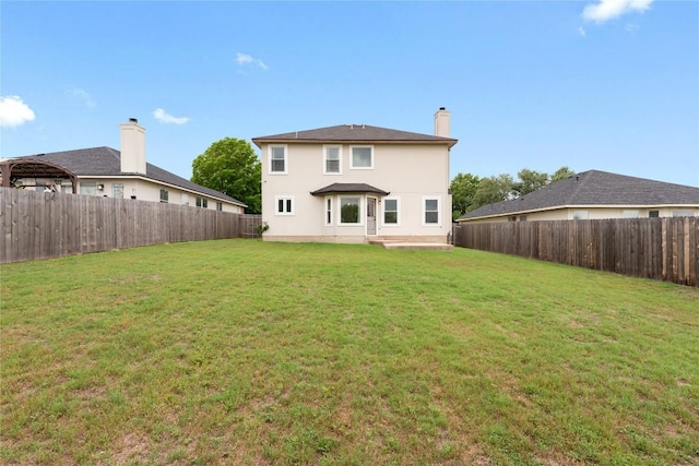 234 Saint Marys Dr, Hutto, TX 78634 - rear view of property featuring a fenced backyard, stucco siding, and a yard