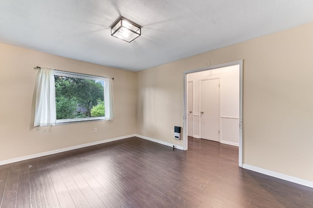 11600 Eubank Dr, Austin, TX 78758 - unfurnished room featuring dark wood finished floors