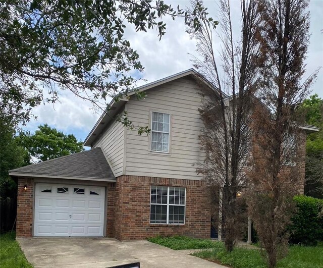 619 Ellen Ct, Temple, TX 76501 - view of front of home with brick siding, a garage, driveway, and a shingled roof