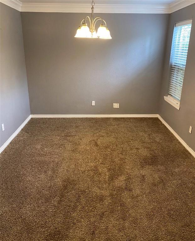 619 Ellen Ct, Temple, TX 76501 - unfurnished room with carpet floors, baseboards, a chandelier, and ornamental molding