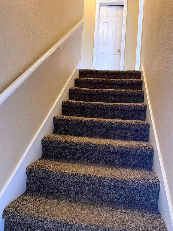stairs with a textured wall