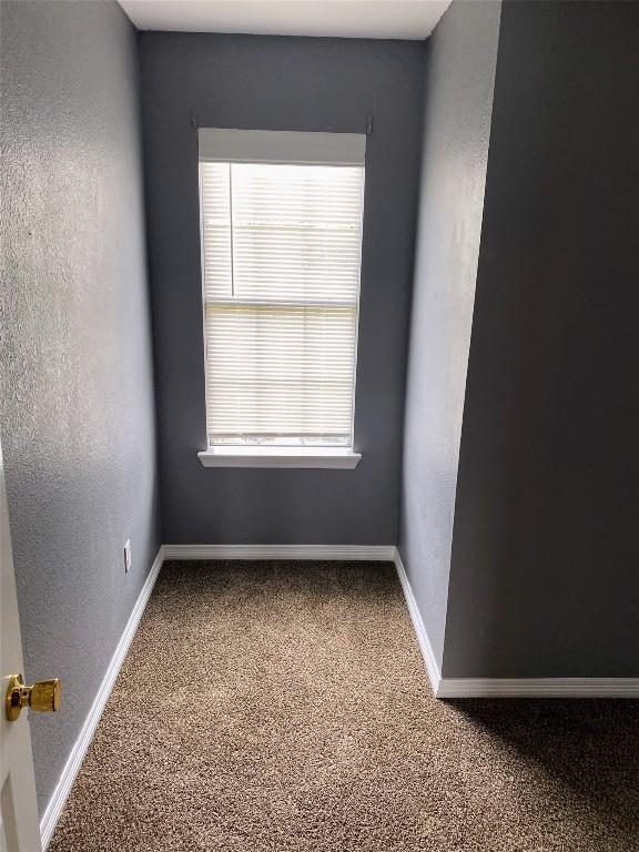 619 Ellen Ct, Temple, TX 76501 - carpeted empty room with baseboards