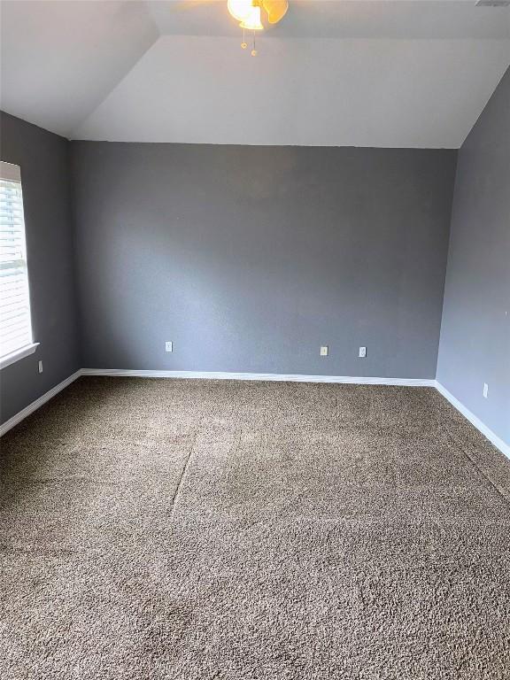 619 Ellen Ct, Temple, TX 76501 - carpeted empty room with vaulted ceiling and baseboards