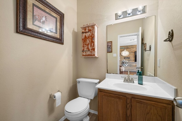half bath with vanity and toilet